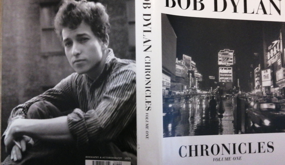 Partial photo of both front and back cover of Bob Dylan's Chronicles Volume one